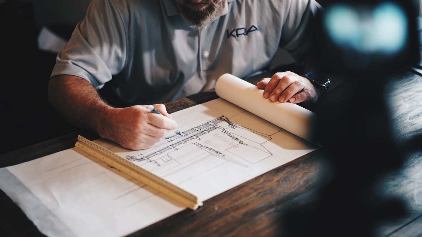 Meridian architect reviewing detailed construction plans